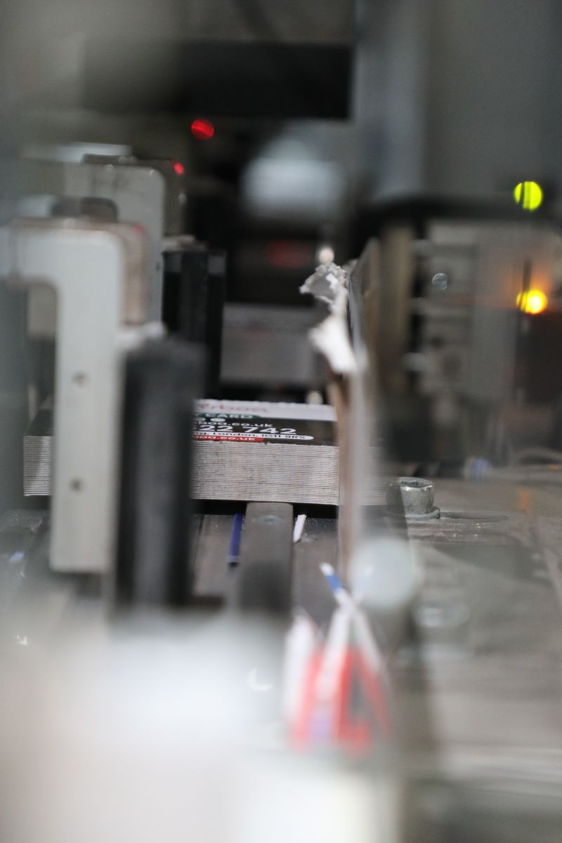 Business cards on the AutoPunch conveyor