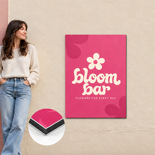 Pink A1 aluminium sign with Bloom Bar branding mounted outside a florist, with a person for scale and an inset showing the composite edge.